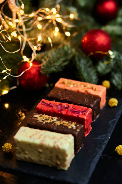 istock Mousse Christmas pastry mini cake dessert with new year decorations 1345143744