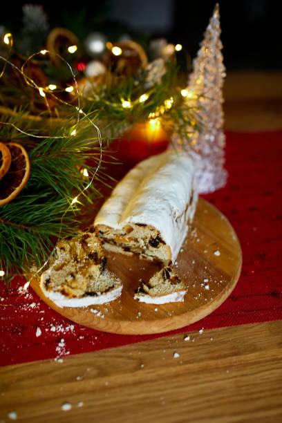 istock Stollen German christmas bread, Christmas stollen on wooden background 1345143749
