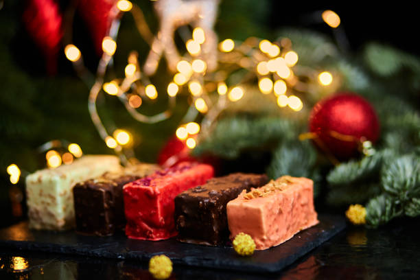 istock Mousse Christmas pastry mini cake dessert with new year decorations 1345143761