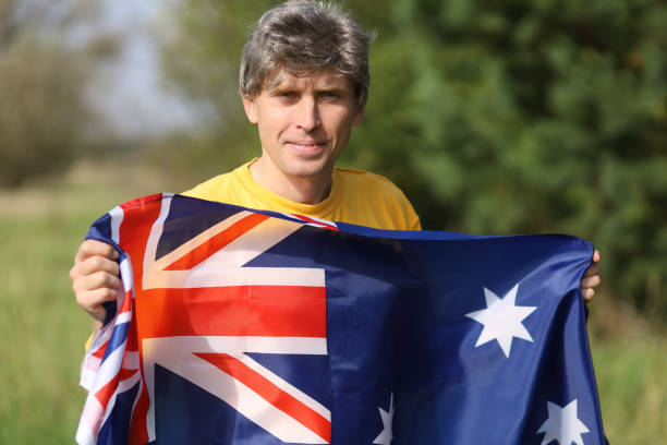 istock Australia flag in human hands 1345144369