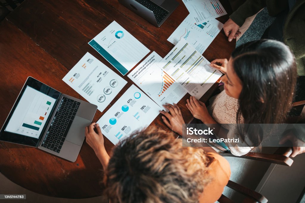 Freelancers working on new projects Group of millennials working in the office. Young creative team cooperating on new commitments. Business Stock Photo