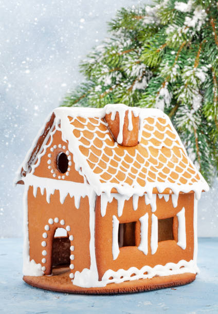 istock Christmas greeting card with gingerbread house 1345144970