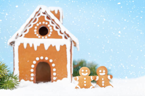 istock Christmas greeting card with gingerbread house 1345145033