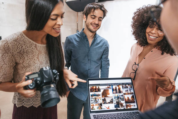 istock Photographer and her team working in a fashion studio 1345146463