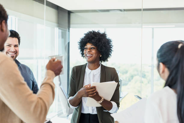istock Diverse employees enjoy coffee break after meeting 1345146549