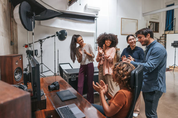 istock Photographer and her team contragulating after the shoot 1345147017
