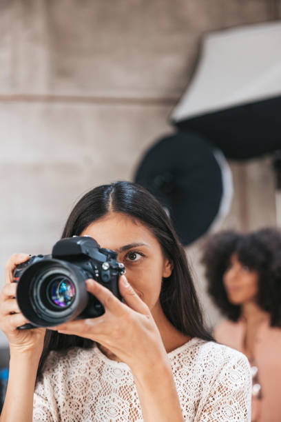 istock Photographer working in a fashion studio 1345149126