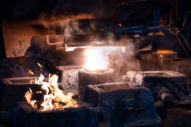 istock Liquid metal is poured into molds from the ladle 1345149144