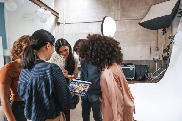 istock Photographer and her team working in a fashion studio 1345149189