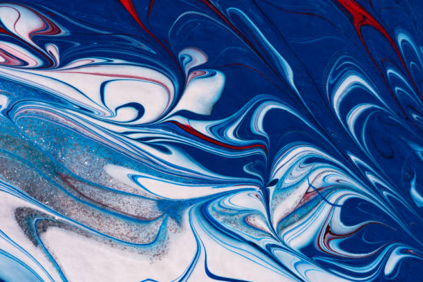 Red, white, blue acrylic fluid art, abstract creative Christmas background. Artistic bright futuristic background. Dynamic lines, water movement, splash. Design of holiday cards. Marble trendy texture