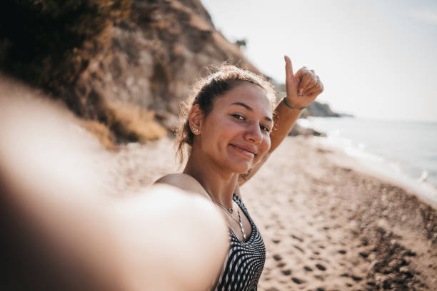 istock Woman poses and exercises on the beach 1345151740