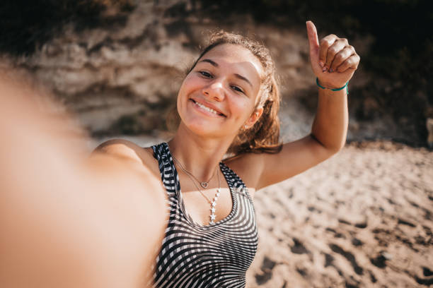 istock Woman poses and exercises on the beach 1345151862
