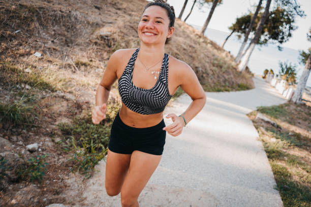istock A woman is running in the park 1345151915
