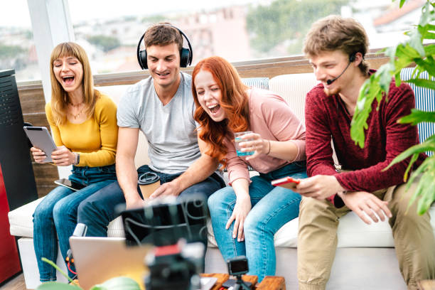 istock Young friends influencer having fun on streaming platform with web cam - Content marketing concept with millennial guys and girls sharing live vlog feeds on social media network - Bright vivid filter 1345152234