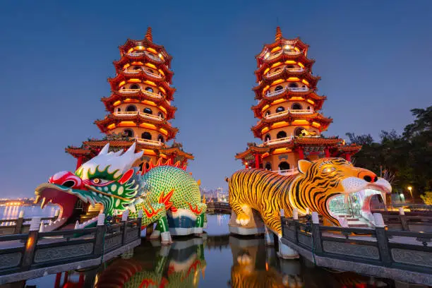 Kaohsiung, Taiwan Dragon and Tiger Pagodas at Lotus Pond at night.