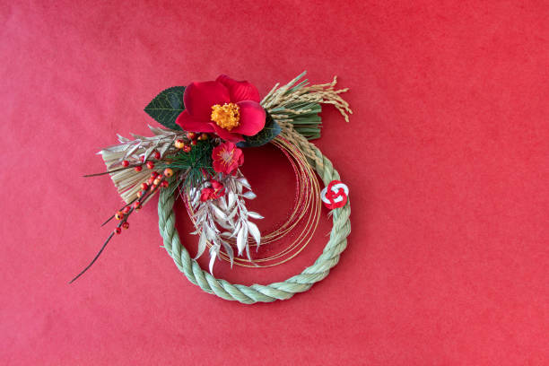 istock red camellia wreath for New year 1345155935