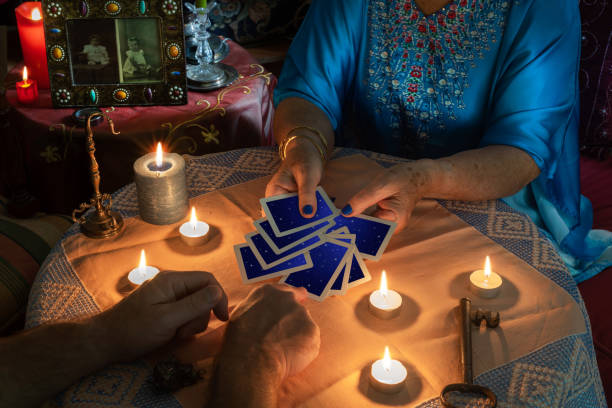 istock A fortune teller gives a client a tarot card to choose from 1345157873