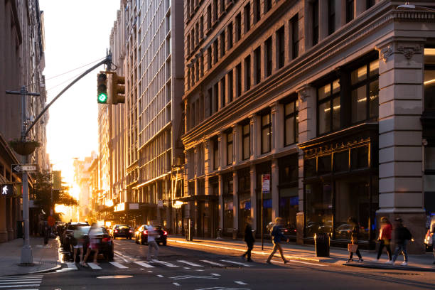 istock Busy intersection with crowds of people walking through an intersection on 5th Avenue in New York City 1345159364