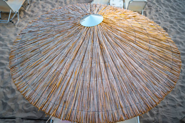 Straw sun umbrella Straw sun umbrella at beach straw roof stock pictures, royalty-free photos & images