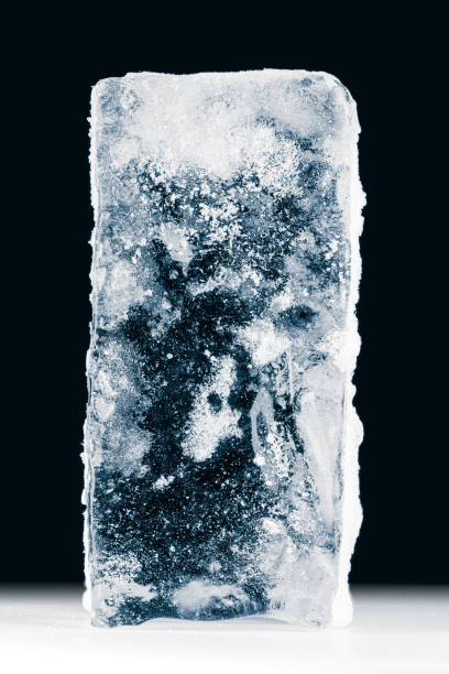 a big textured rectangle of ice on black background. - ice blocks imagens e fotografias de stock