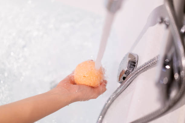 Woman holding a bath bomb.