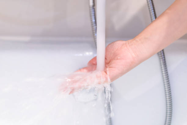 istock Woman checking a water temperature. 1345161824