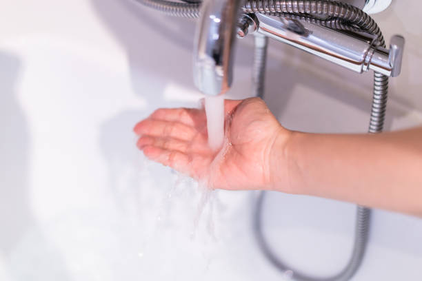 istock Woman checking a water temperature. 1345161869
