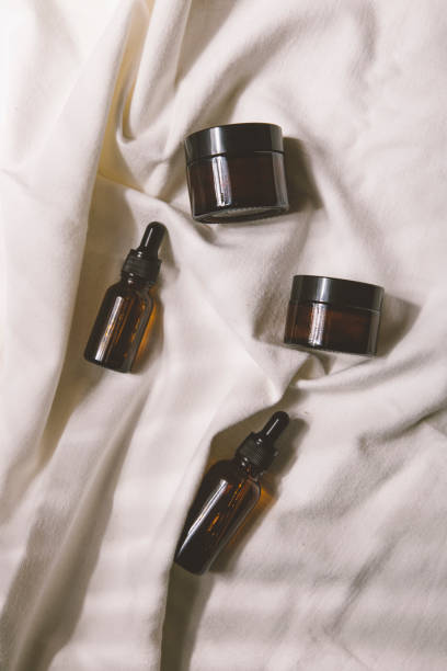 istock stylish cosmetic bottles on a light background 1345163249