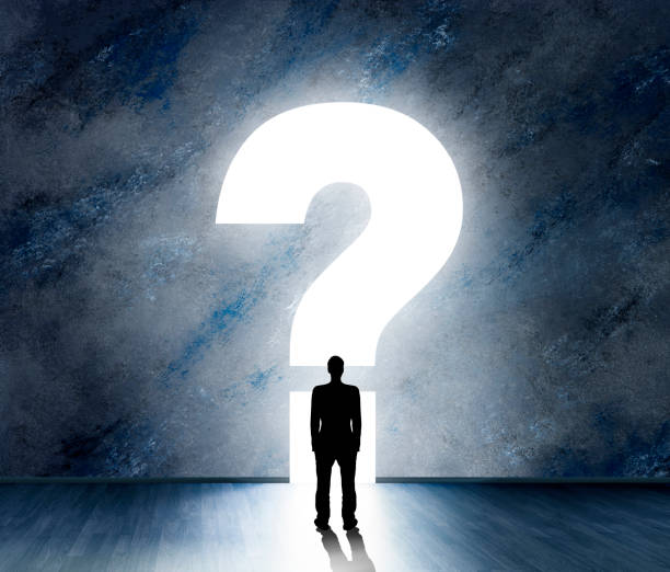 Silhouette of a male person in front of a question mark Silhouette of a male person in front of a question mark mystery stock pictures, royalty-free photos & images