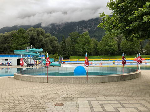 VADUZ, LIECHTENSTEIN, AUGUST 8, 2021 Public outdoor swimming pool on a cloudy day without guests