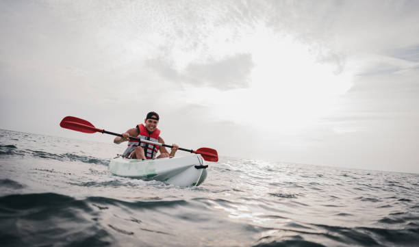 istock Man kayaking in the ocean 1345169953