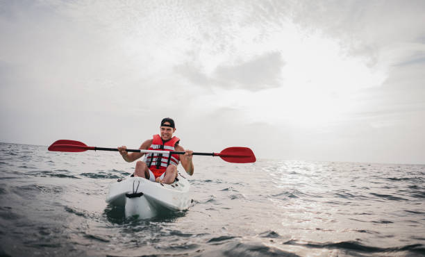 istock Man kayaking in the ocean 1345170042