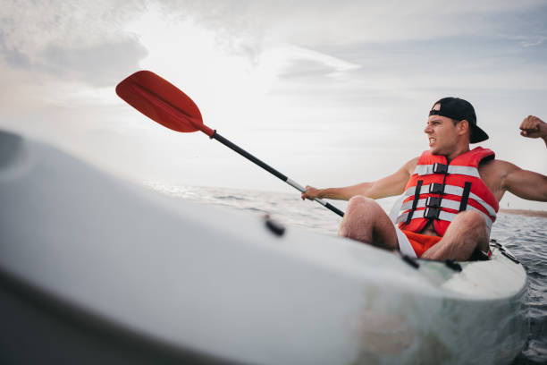 istock Man kayaking in the ocean 1345170046
