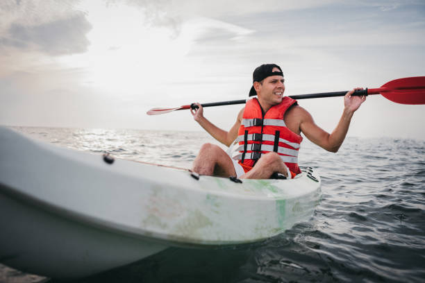 istock Man kayaking in the ocean 1345170316