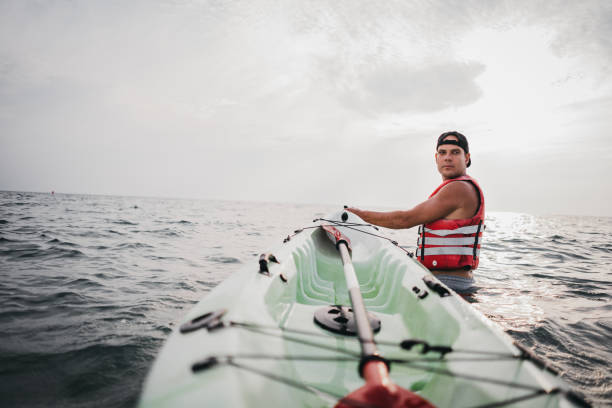 istock A man with a kayak enters the water 1345170354