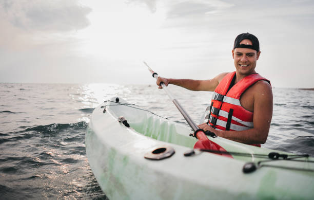 istock A man with a kayak enters the water 1345170405