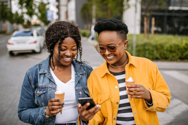 istock Two friends having fun in the city 1345172323