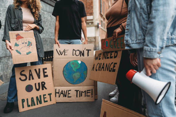 istock People are holding banner signs while they are going to a demonstration against climate change 1345174241