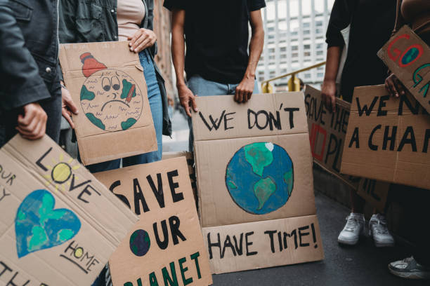 istock People are holding banner signs while they are going to a demonstration against climate change 1345174245