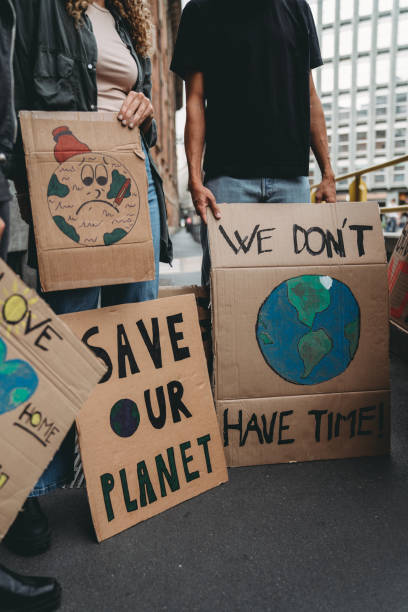 istock People are holding banner signs while they are going to a demonstration against climate change 1345174251