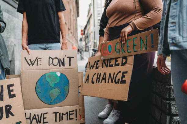istock People are holding banner signs while they are going to a demonstration against climate change 1345174257