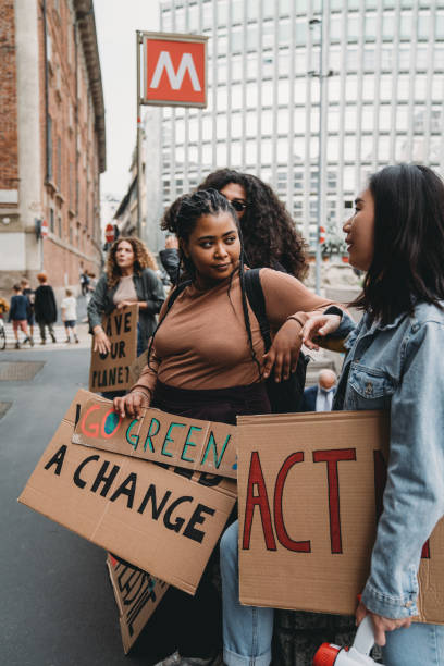 istock People are holding banner signs while they are going to a demonstration against climate change 1345174262