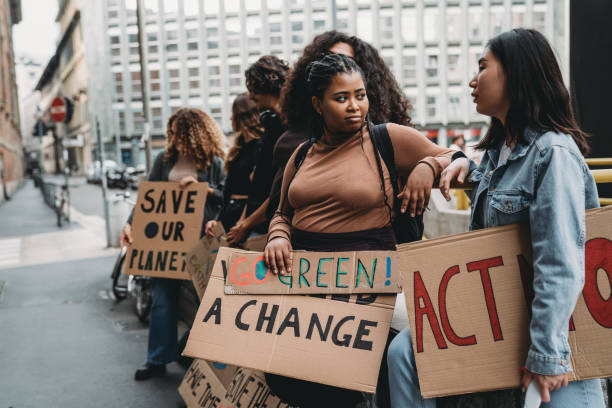 istock People are holding banner signs while they are going to a demonstration against climate change 1345174263