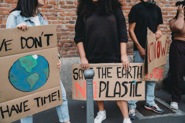 istock People are holding banner signs while they are going to a demonstration against climate change 1345174284