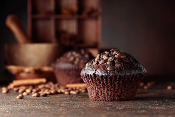 istock Chocolate muffins on a brown background. 1345175033