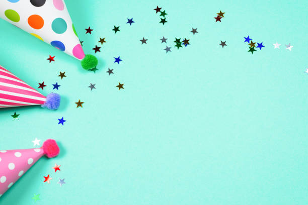 istock Colorful birthday caps on a blue background. Top view. 1345176989