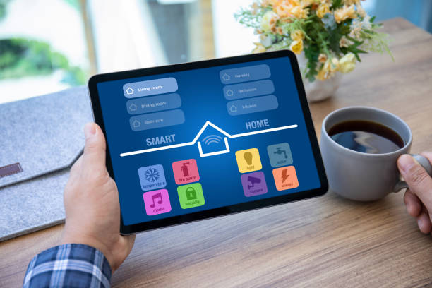 istock male hands holding computer tablet with app smart home 1345180275
