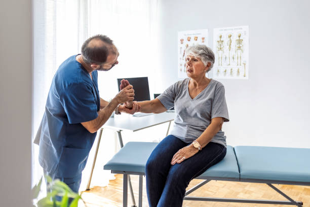 istock Physical Doctor consulting with patient wrist problems 1345182268