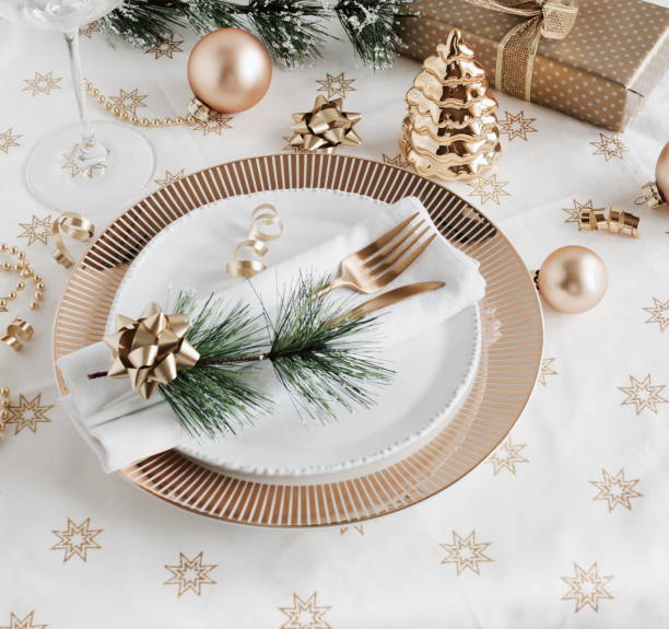 istock Christmas or New Year table setting with white golden cutlery 1345182650