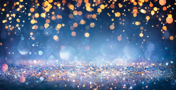 istock Abstract Christmas Lights On Shiny Glitter In Blue Night 1345182921